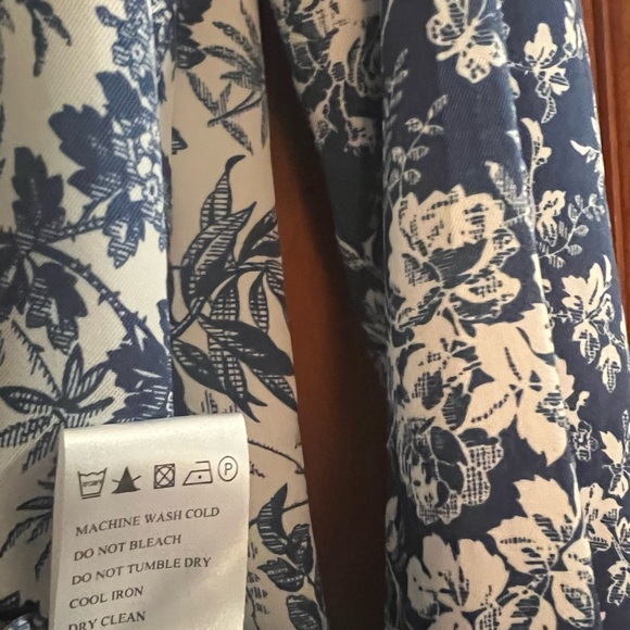 A beautiful button-up blouse to dress up or go casual. Navy & white floral. - Picture 7 of 8